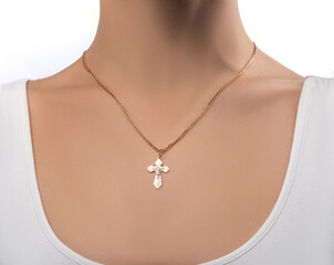 isolated on white background jewelry silver cross on a golden chain around the neck of a model girl. Front and side view of jewelry on girl