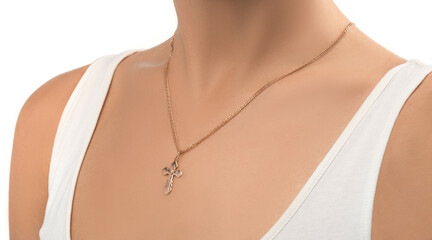 isolated on white background jewelry silver cross on a golden chain around the neck of a model girl. Front and side view of jewelry on girl