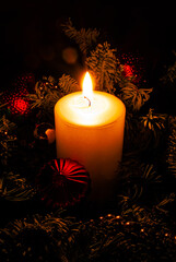 Blurred focus. Christmas background. The candle is burning. Christmas.