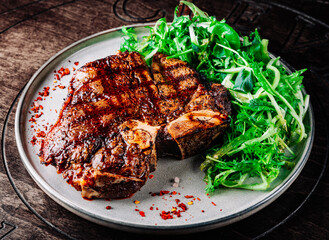 Porterhouse beef steak cooked on a grill on plate