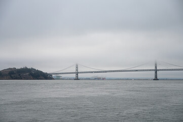 Detail of the entrance bridge to the port of San Francisco, between the fog