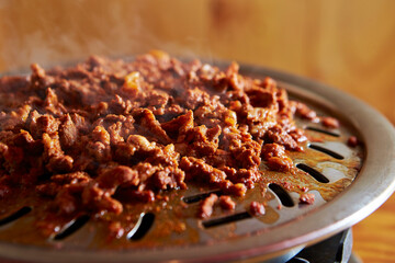 Stir-fried spicy meat on iron plate