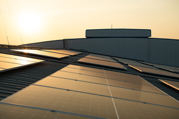 Solar farm on roof and sunset Solar modules for renewable energy technology