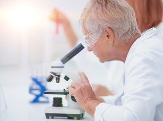 female scientist conducts research in the laboratory.