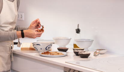 preparation sauce, with its corresponding container in the kitchen at home, located in the city.
