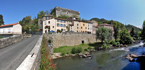 Aude river cityscape with the medieval castle ruins on top of the old town of Quillan, Occitanie...