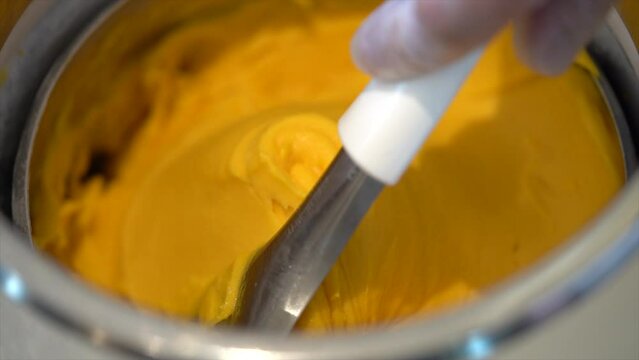 yellow mango ice cream shop, one box of ice cream gelato in a shop.