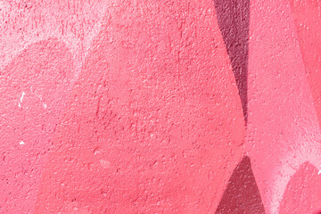 Closeup of colorful pink, rose, coral urban wall texture. Modern pattern for wallpaper design....