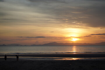 Beach and sun shining.