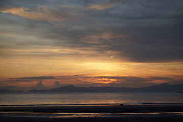 Beach and sun shining.