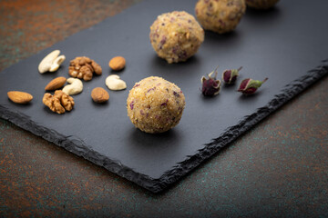 Dry fruit ladoo is a healthy ladoo prepared with only dry fruits without any sugar or jaggery, consumed in winter in India.