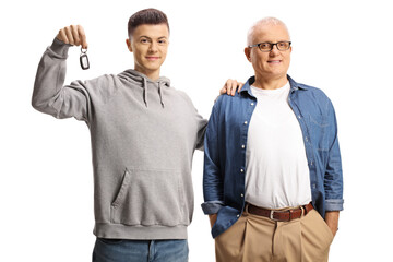 Happy and proud father and son showing a car key
