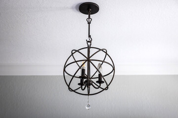 Black hanging sphere modern light fixture