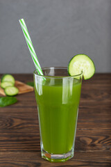 Cold cucumber lemonade with basil and lemon in a glass.