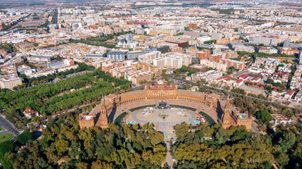 Aerial view of the Spanish city of Seville in the Andalusia region on river Guadaquivir overlooking Plaza de Espana and Parque Maria Luisa