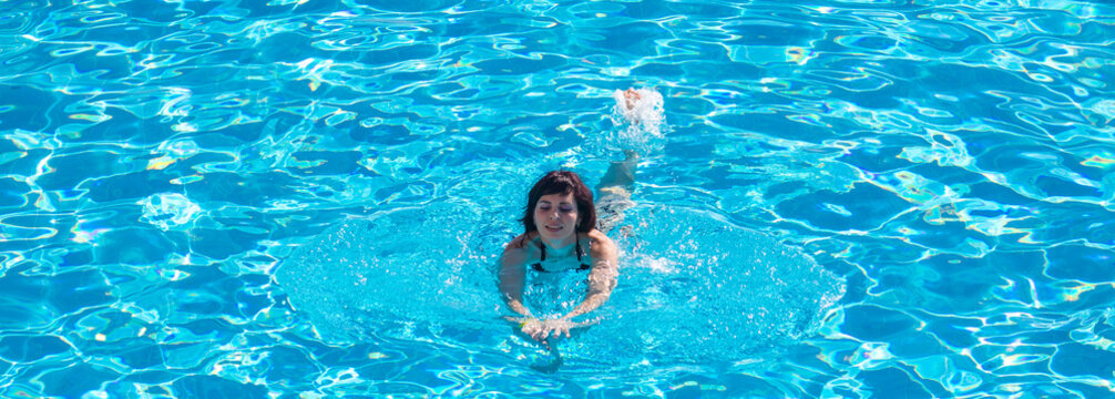 Woman Bathes Pool Near The House Escaping From Summer Heat.