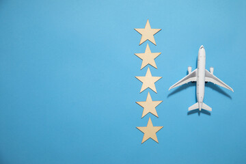 Airplane with a 5 stars on the blue background.