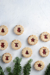 Christmas cookies, Linzer cookies on the light background, different motifs.