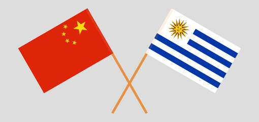 Crossed flags of China and Uruguay. Official colors. Correct proportion