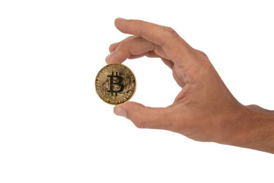 Hand holding with its fingers a golden bitcoin coin with transparent background