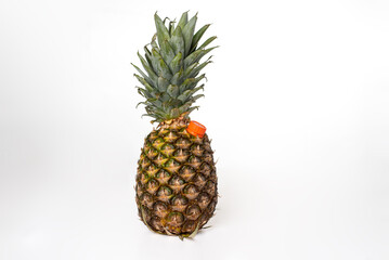 Fototapeta premium Pineapple,fruit, on white background,with spout to drink as a juice pot,close-up.