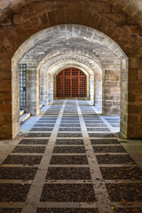 Palma de Mallorca, Spain - 7 Nov, 2022: Tunnel through the outer wall of the Royal Palace of La Almudaina