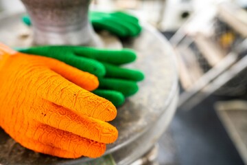 fisherman wearing waterproof clothes and gloves on a fishing boat in australia in summer
