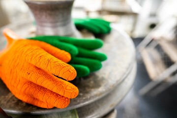 fisherman wearing waterproof clothes and gloves on a fishing boat in australia in summer