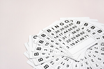 A lot of cards for a board game of bingo or lotto on a light background.