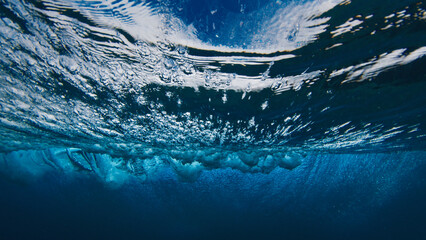 Underwater view of the breaking ocean wave