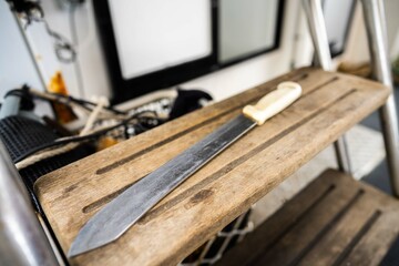 big fish gutting knife on a fishing boat