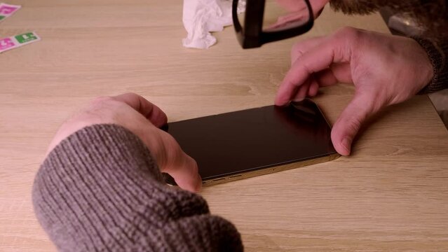 closeup modern gadget apple in male hands, testing new gold smartphone iPhone 14 Pro Max with Super Retina display, Mobile device voice via radio, satellite communication, Frankfurt - December 2022