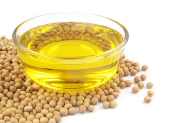 Glass bowl with cooking oil and soybeans isolated on white background