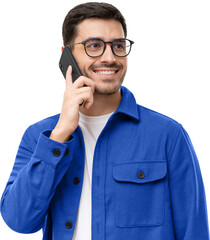 Portrait of handsome young man in blue shirt and glasses, answering phone call, looking aside with smile