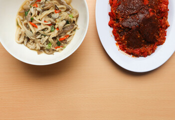 Traditional indonesian culinary food. Tumis jamur or Sauteed Spicy Mushroom and Jerky Beef (dendeng...