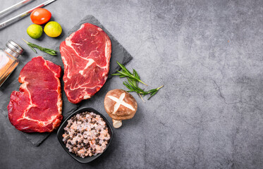 Fresh beef steak on a concrete background