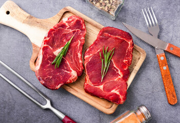 Fresh beef steak on a concrete background