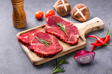 Fresh beef steak on a concrete background