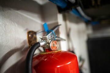 fire extinguisher in the engine room of a boat - obrazy, fototapety, plakaty