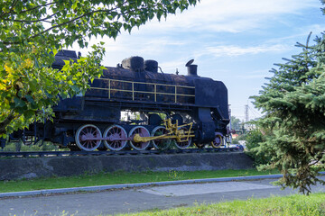 Monument old soviet locomotive. Rarity transport of communism. Steam engine train from second world...