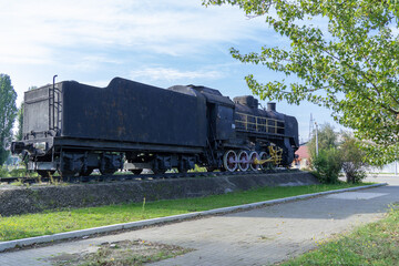 Monument old soviet locomotive. Rarity transport of communism. Steam engine train from second world...