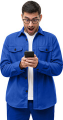 Surprised young man in blue shirt looking at his smartphone with amazed facial expression, shocked...