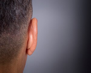 close up of a male ear from behind - obrazy, fototapety, plakaty