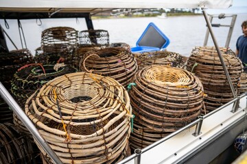 crayfish cray pots on the back of a fishing boat in tasmania australia