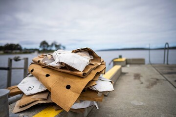 recycling cardboard after a fishing trip on a boat