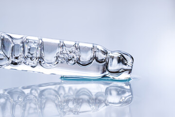 Close-up pipette with Face Serum or Essential Oil with Oxygen Aqua Bubbles. Macro, side view, space for text.