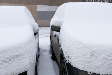Car covered with snow after a snowfall  (Corrected).