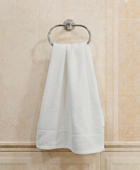 White towel hanging in the bathroom