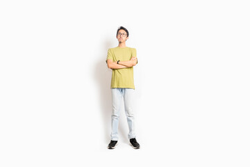 Naklejka premium Single skinny young male. The full body of an Asian or Indonesian person. Isolated photo studio with white background.