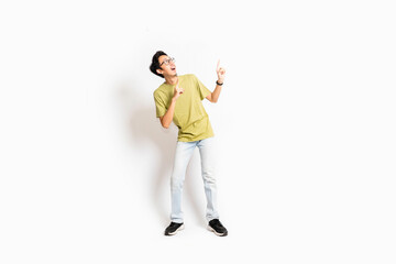 Single skinny young male. The full body of an Asian or Indonesian person. Isolated photo studio with white background.